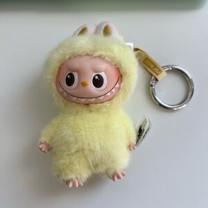 The monsters labubu- pin for love series 1- yellow “F”
